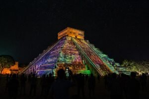 experience the enchanting chichen itza light show night tour and explore the ancient wonders illuminated under the stars. a magical journey into mayan history awaits you.
