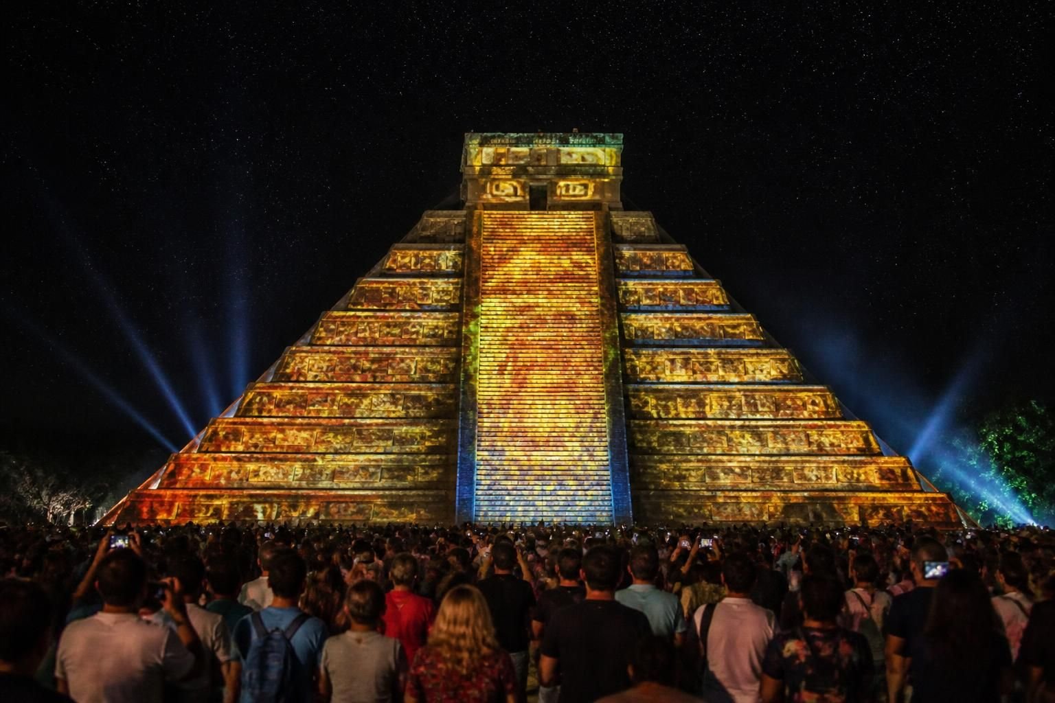 experience the enchanting chichen itza sound and light show, where history comes alive through mesmerizing lights and captivating storytelling under the stars.